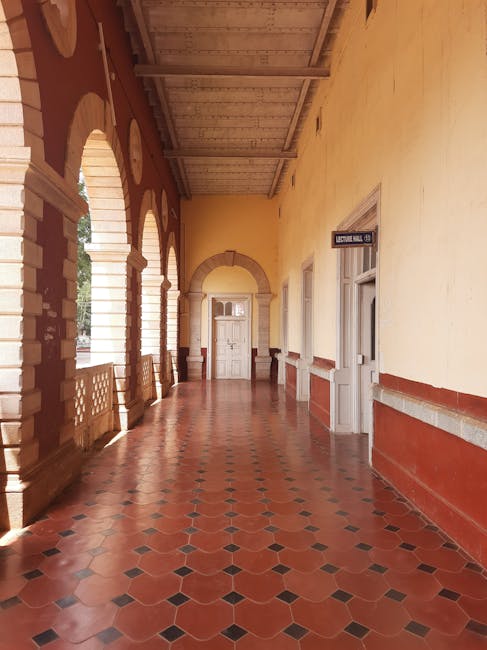 A beautifully crafted corridor with arches at an Indian university in Dharwad, India.